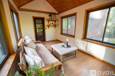 A cozy living room with a sofa and a coffee table.