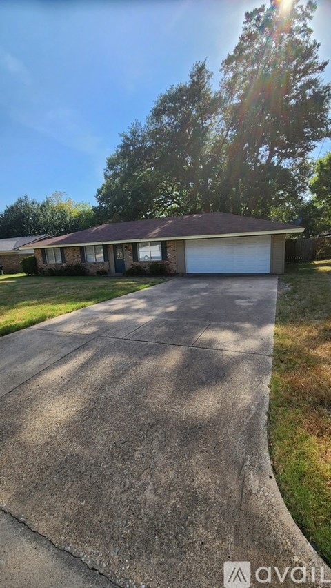 A house with a driveway in front of it.