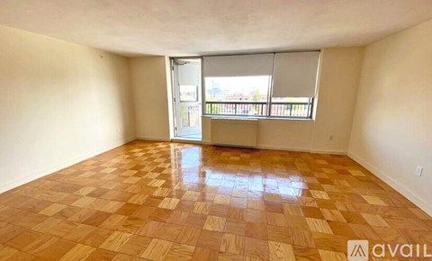 A room with a checkered floor and a sliding glass door.