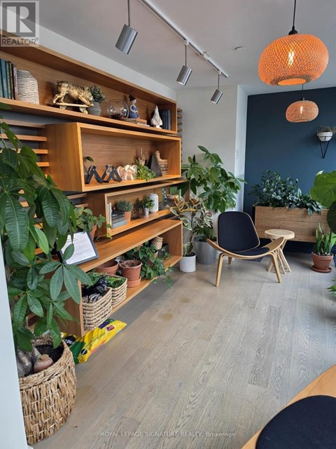A room with a wooden shelf and a chair.