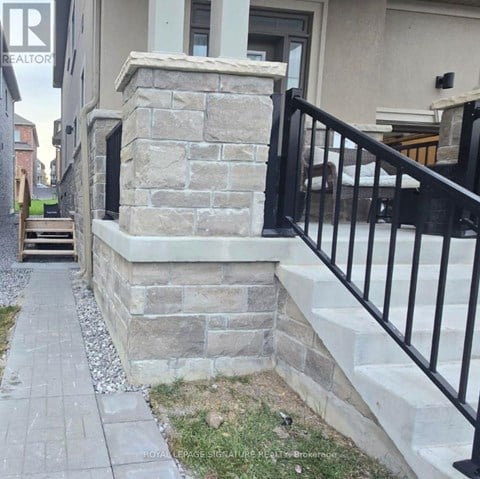 A stone staircase leads up to a house with a sign that says "TEALTO".