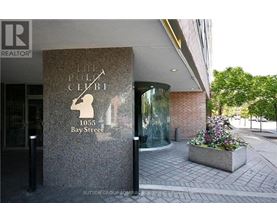 The front of a building with a sign that says "The Polo Club" on it.