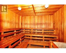 A sauna with wooden benches and walls.