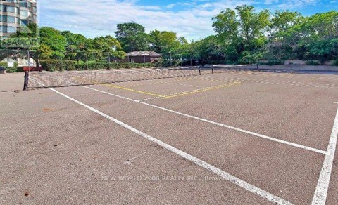 A tennis court with white lines and a yellow line in the middle.