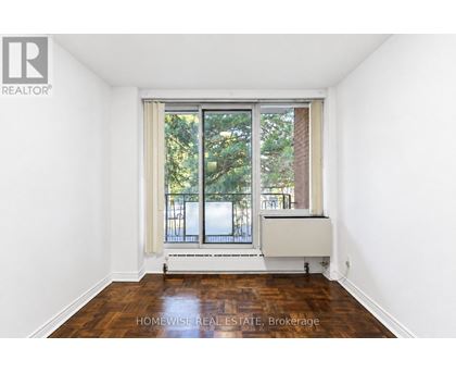 A room with a window and a radiator.