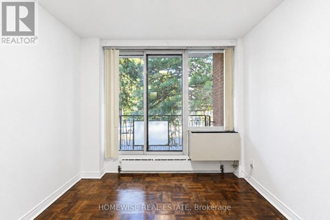 A room with a window and a radiator.