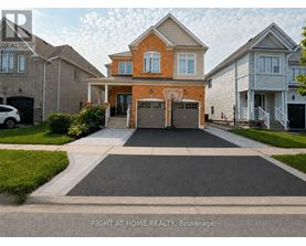 A house with a driveway in front of it.
