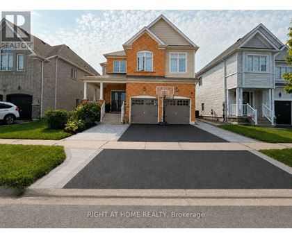 A house with a driveway in front of it.