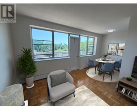 A living room with a view of the city through the windows.