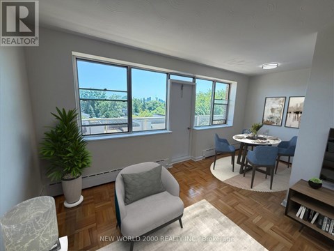 A living room with a view of the city through the windows.