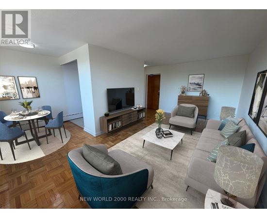 A living room with a grey couch and a coffee table.