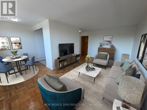 A living room with a grey couch and a coffee table.
