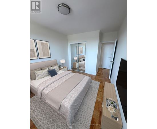 A bedroom with a large bed and a flat screen TV.
