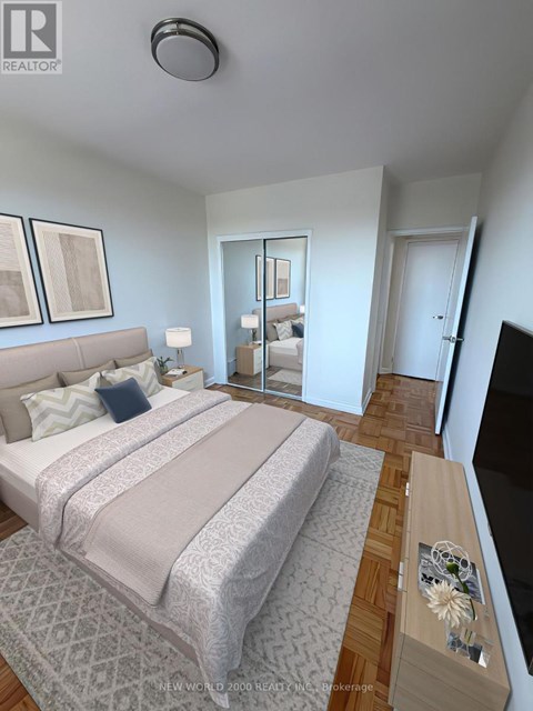 A bedroom with a large bed and a flat screen TV.