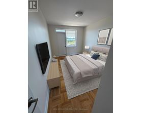 A bedroom with a bed, a television, and a window.