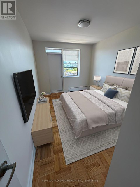A bedroom with a bed, a television, and a window.