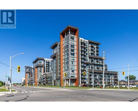 A modern multi-story building with a glass facade and a wooden top.