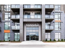 A modern building with the name "trend 3" on the front.