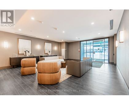 A spacious living room with a grey floor and a white ceiling.