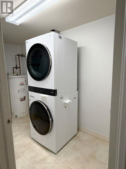 A white dryer and washer in a laundry room.