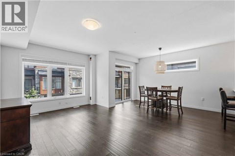 A dining room with a table and chairs is shown.