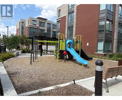 A playground with a blue slide and a yellow slide.