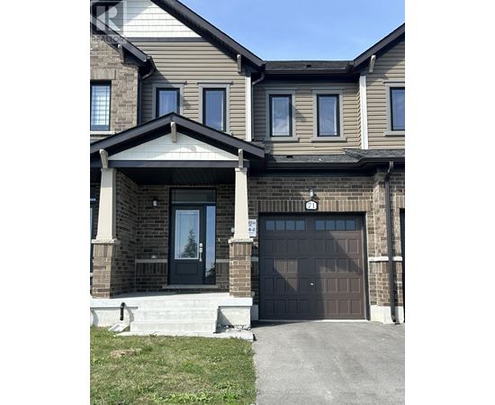 A two-story house with a black front door and a garage.
