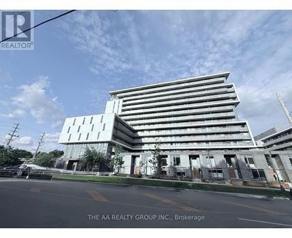 A modern building with a glass facade is the focus of this image.