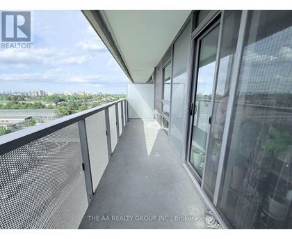A balcony with a view of the cityscape.