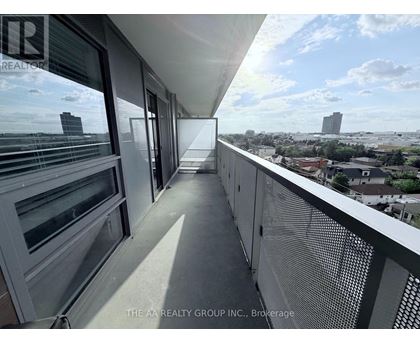 A balcony with a view of the cityscape.