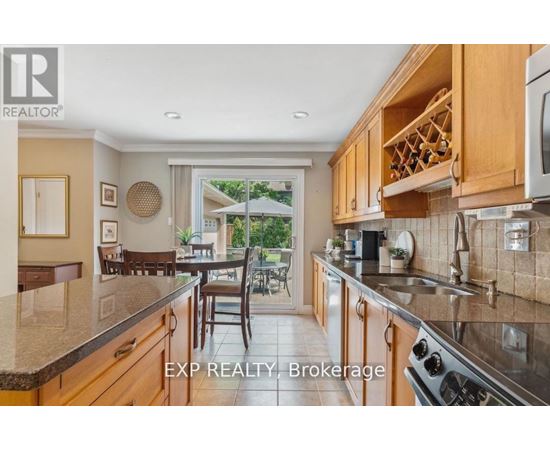 A kitchen with wooden cabinets and a stainless steel stove.
