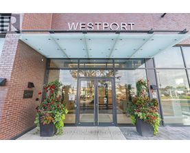 The entrance to a building with the name Westport on it.