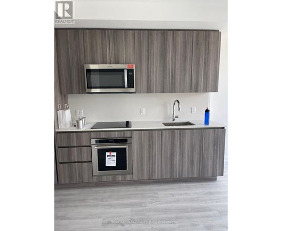 A modern kitchen with a microwave above the stove.