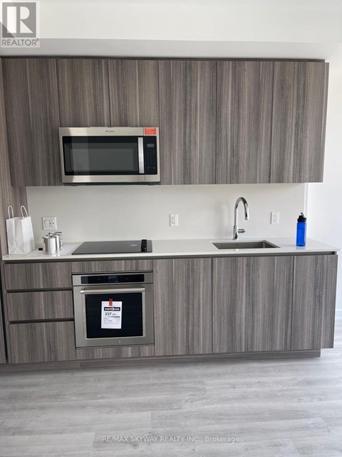 A modern kitchen with a microwave above the stove.