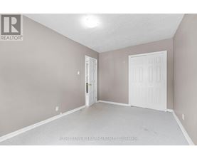 A room with a white door and a white door frame.