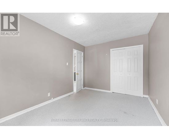 A room with a white door and a white door frame.