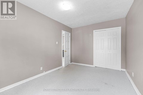 A room with a white door and a white door frame.