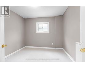A room with a white door and a window with a white frame.