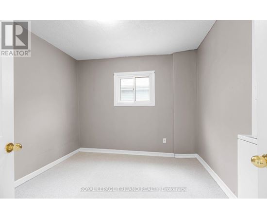 A room with a white door and a window with a white frame.