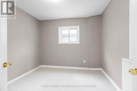A room with a white door and a window with a white frame.