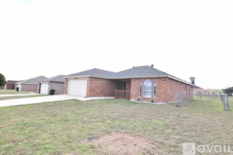 A house with a brick exterior and a white garage door.