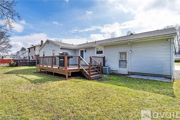 A house with a deck in the backyard.