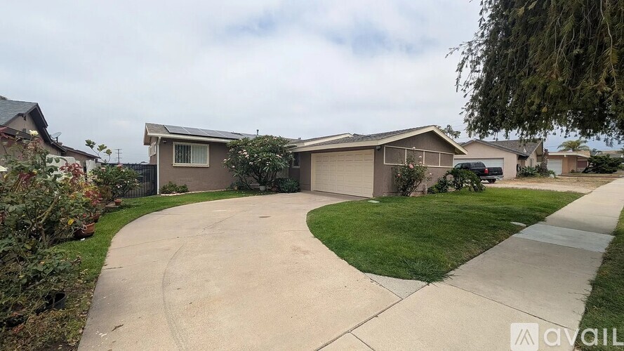 A house with a driveway in front of it.