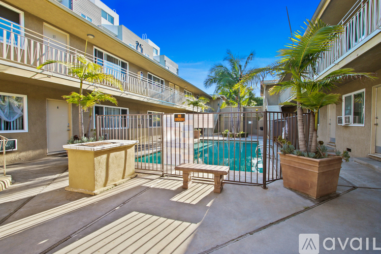 A sunny day at the poolside of a residential building.