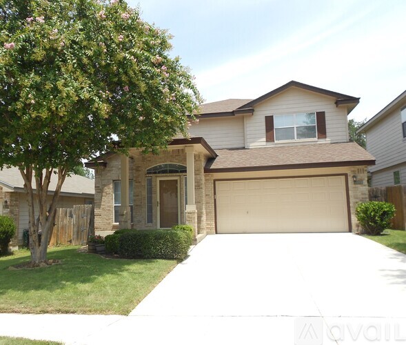 A house with a brown roof and a garage door.