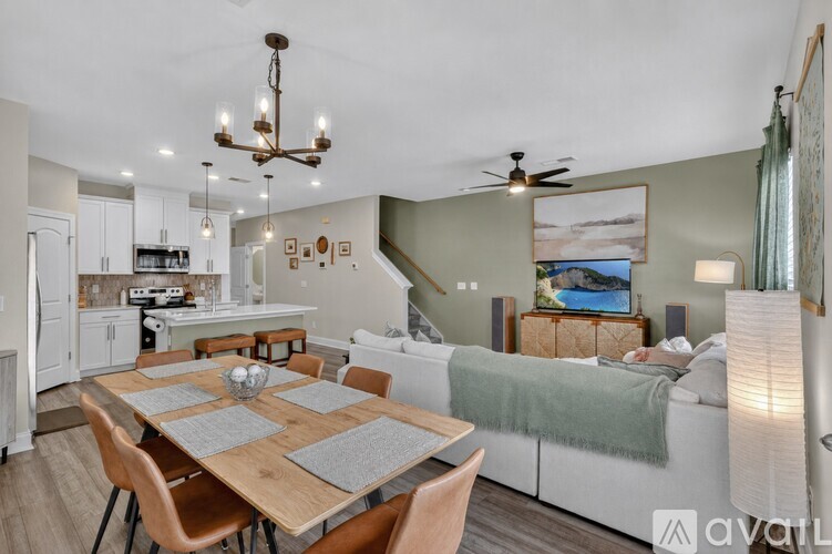 A well-lit dining area with a wooden table and chairs.