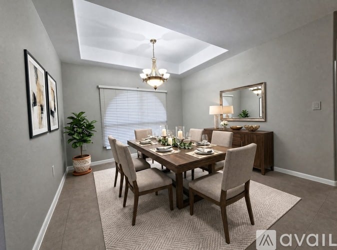 A dining room with a table set for six and a potted plant on the side table.