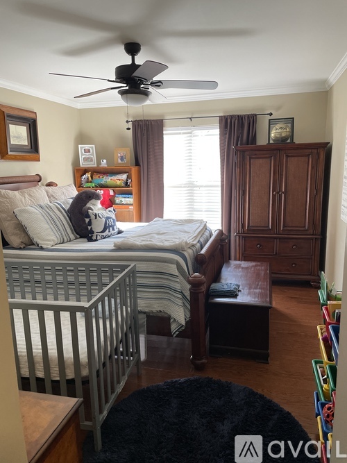 A bedroom with a ceiling fan and a bunk bed.