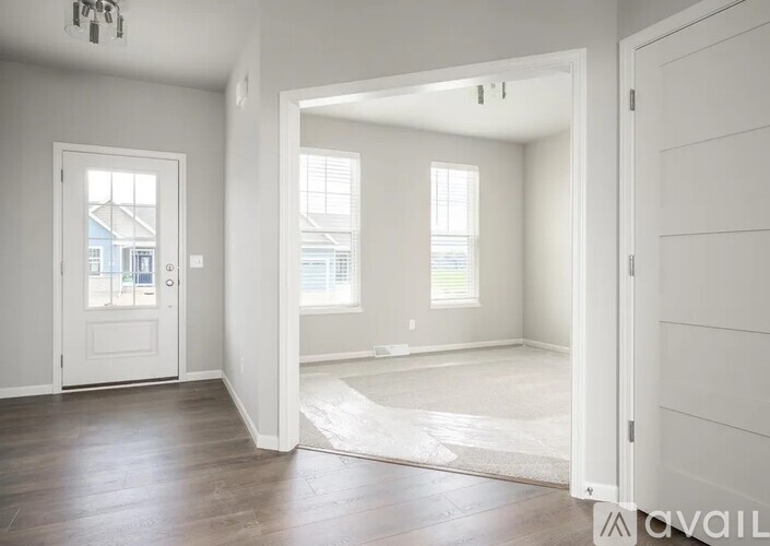 A room with a doorway leading to another room.