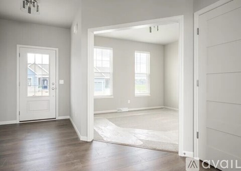 A room with a doorway leading to another room.